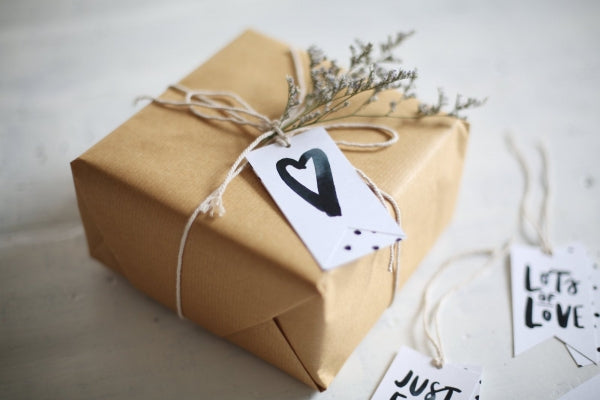 A gift wrapped in brown paper with string.