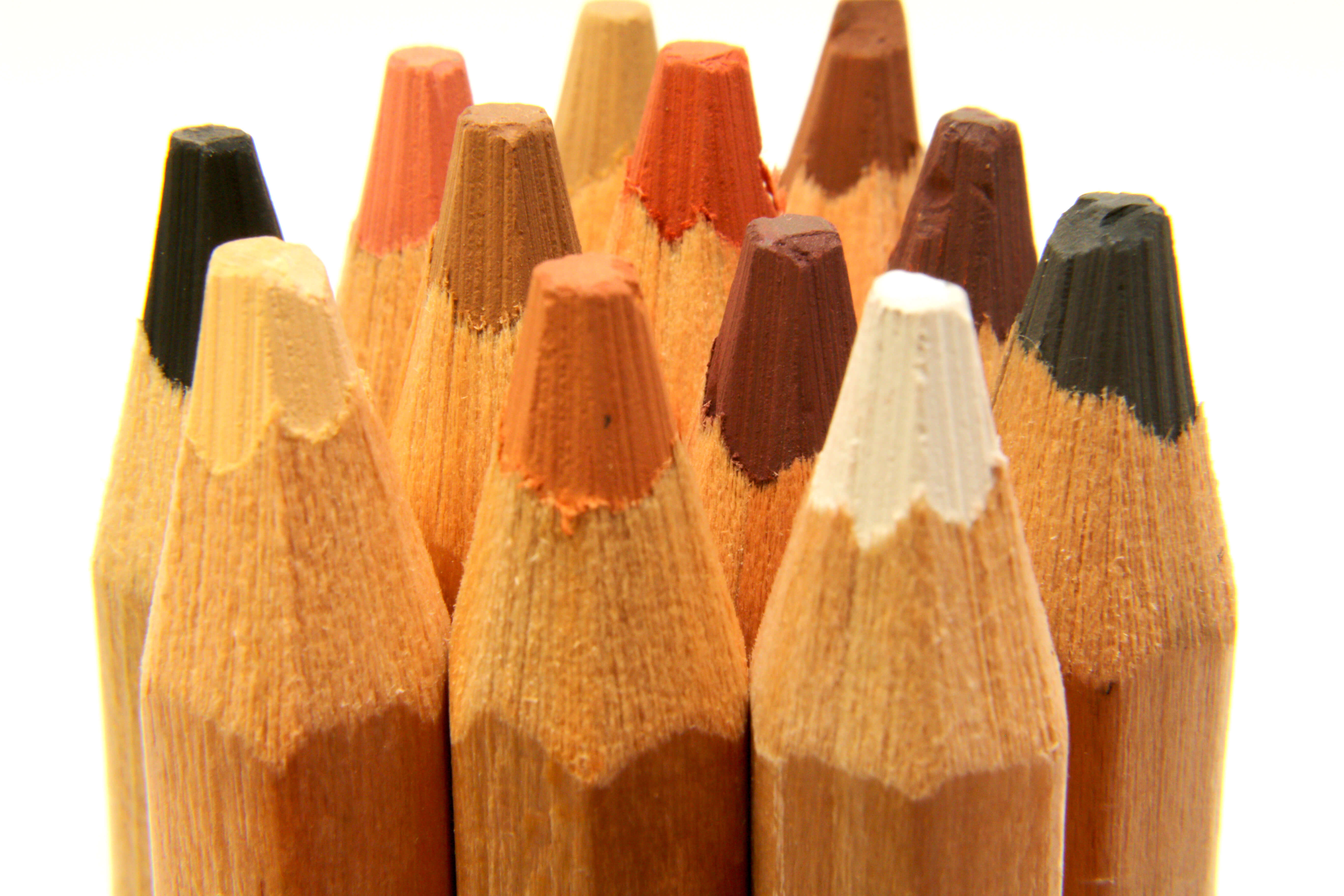 Close up shot of pastel pencils with the leads pointing to the sky.