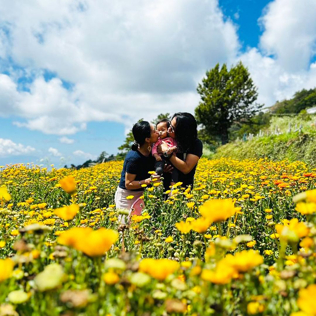 Bianca and her family in a yellow flower field