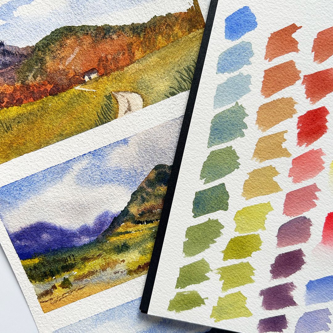 Colour swatches next to a landscape watercolour painting