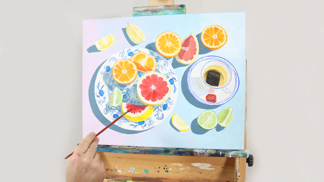 Modern, bright citrus still life painting on an easel