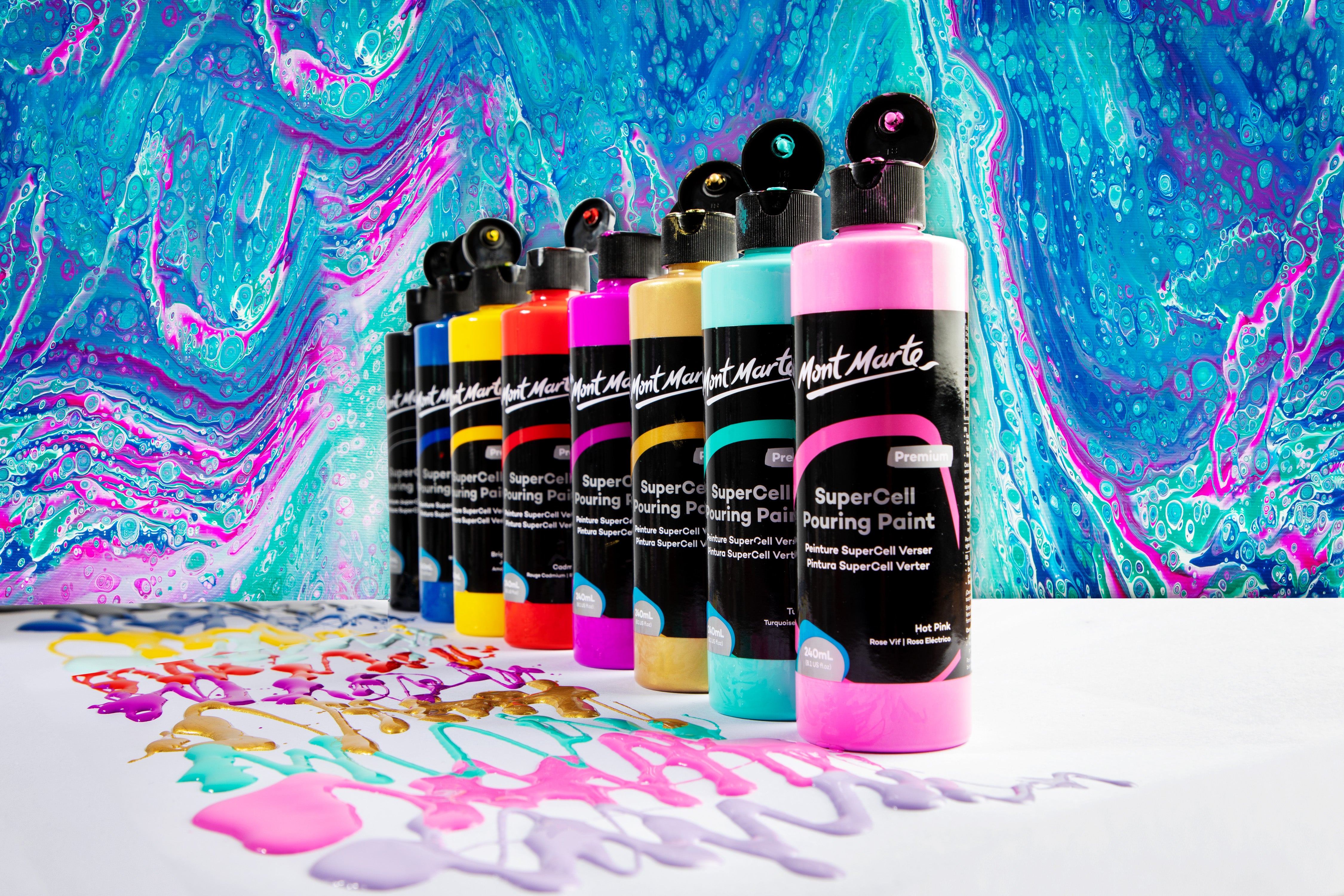 SuperCell 240ml bottles lined up with paint squiggled in front of each colour