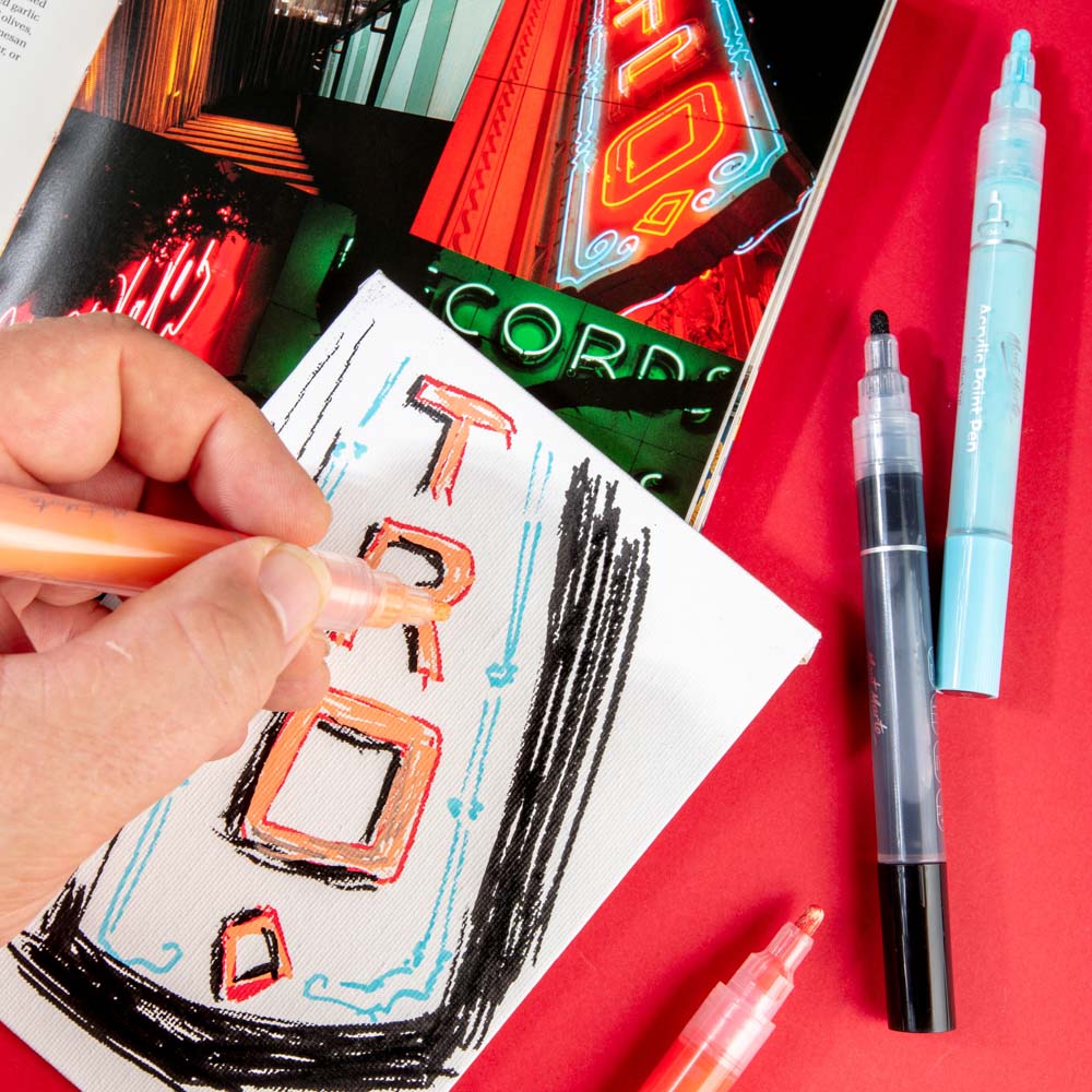 Paint pen being used for quick sketch of neon sign