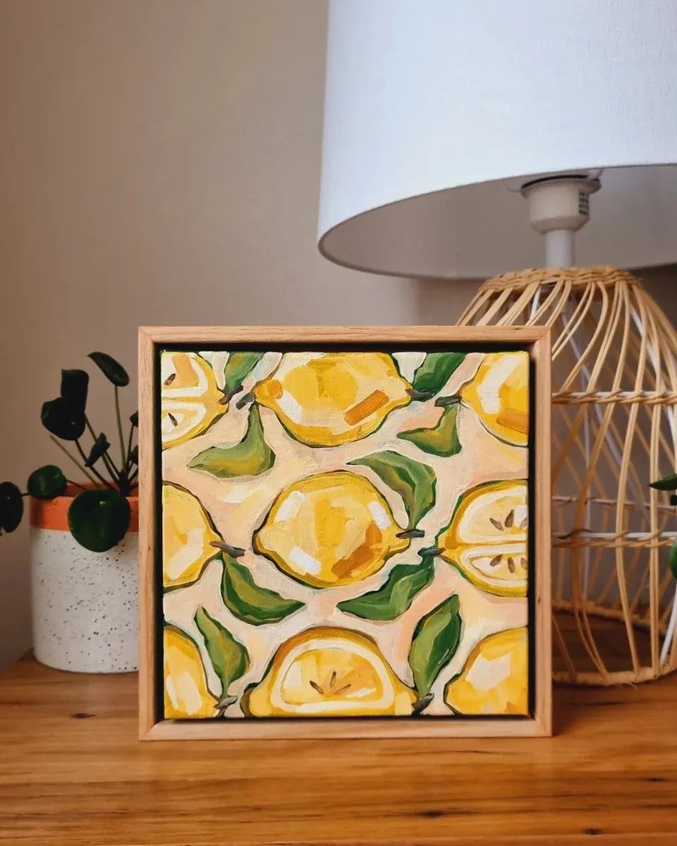 @jacklynfosterart warm toned painting of lemons on a framed canvas