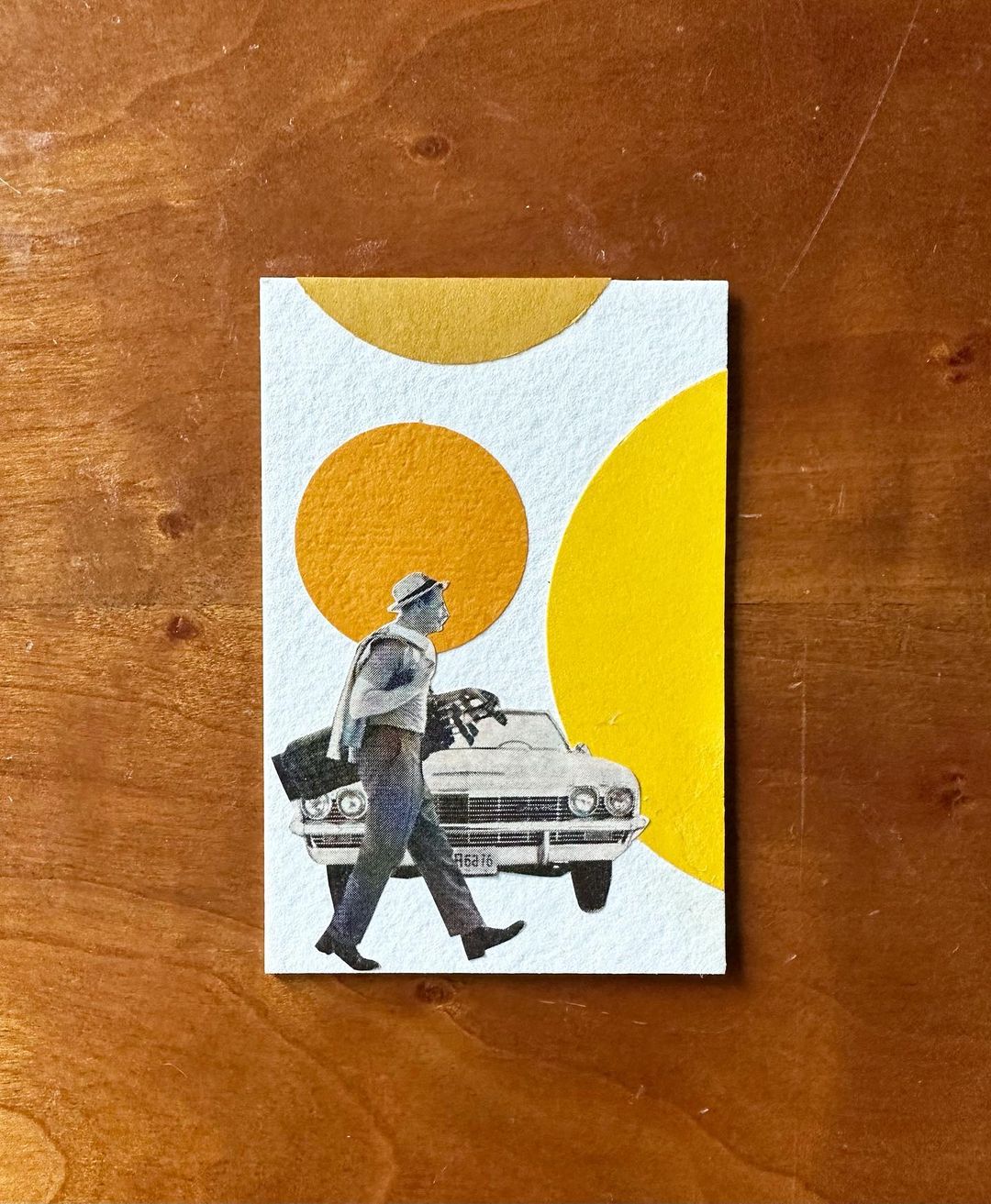 @lpcincy collage artwork of a person walking in front of a car with yellow dotted background