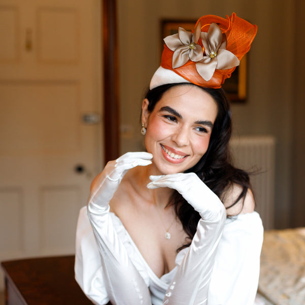 Lulu Bloom’s teardrop head piece with ivory silk and burnt orange detailing