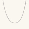 Diamond Tennis Necklace 1.8mm: A silver chain featuring a series of small, sparkling diamonds, handcrafted in 14k solid gold on a white background.