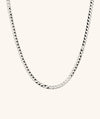 Flat Curb Chain Necklace: A sleek silver chain with black accents, designed to elevate any outfit effortlessly.