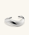 Dôme Figure Cuff: A handcrafted sterling silver bracelet with a sleek, artistic design.