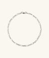 Figaro Chain Bracelet displayed elegantly, showcasing its intricate links. Ideal for wearing solo, doubling up with mixed metals, or stacking with other bracelets for a stylish look.
