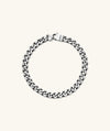 Silver 5mm Curb Chain Bracelet with a lock clasp, handcrafted in oxidized sterling silver for a stylish, lived-in look.