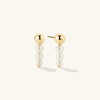 Pearl Drop Earrings featuring multiple pearls in a drop design, perfect for adding elegance to any outfit.