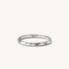 2mm Curve Band - A close-up of a silver ring with a diamond, showcasing its elegant and lightweight design.