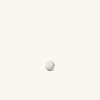 Pos - Straight Mini Thumbtack Flat Back Stud, seen as a round silver button, designed for comfort with a 14k gold front and titanium backing.