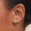 Diamond Flower Flat Back Stud in White Gold on a woman's ear, showcasing its 14k gold and diamond craftsmanship for a stylish, comfortable fit.