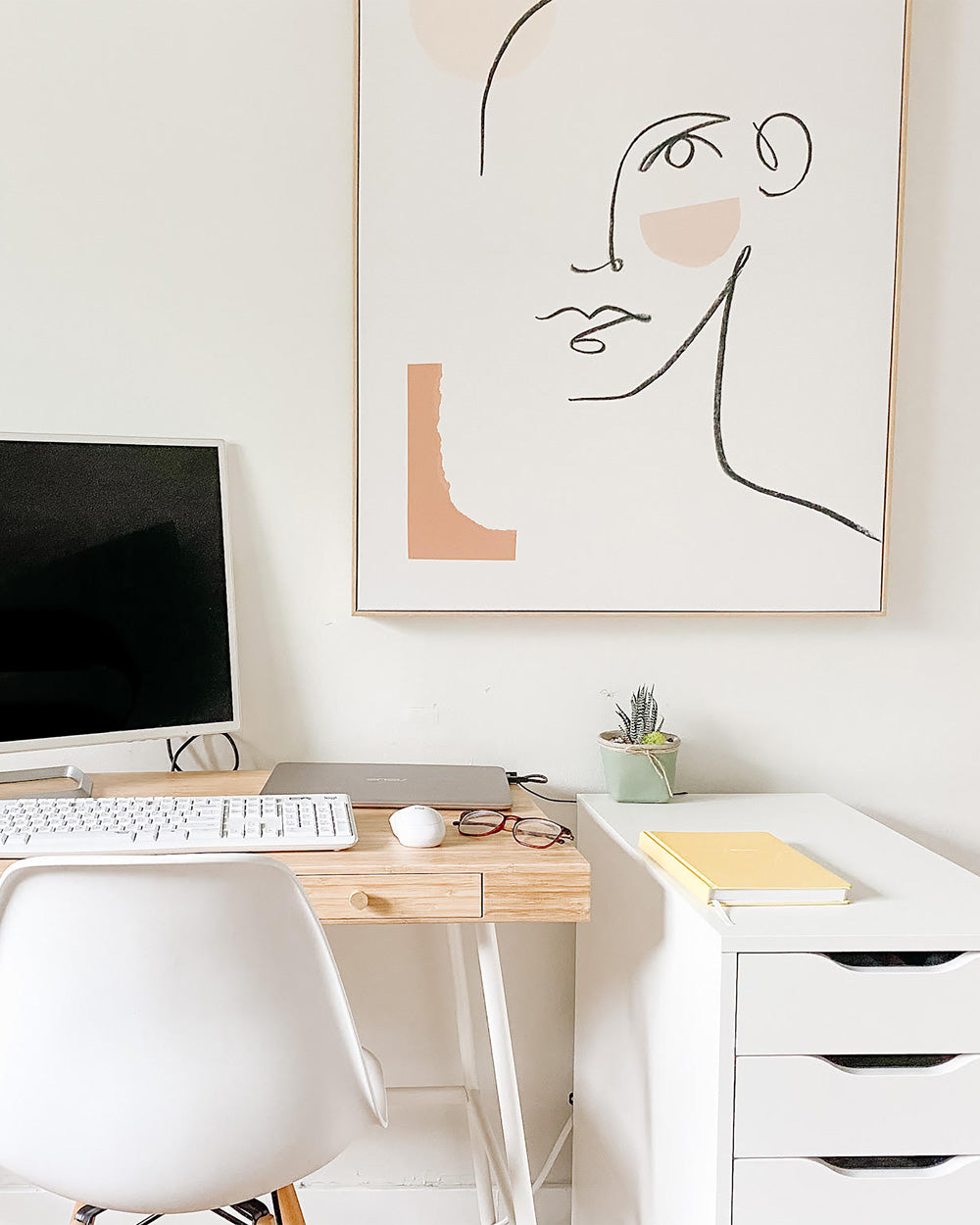 Neutral office space with a desk and computer