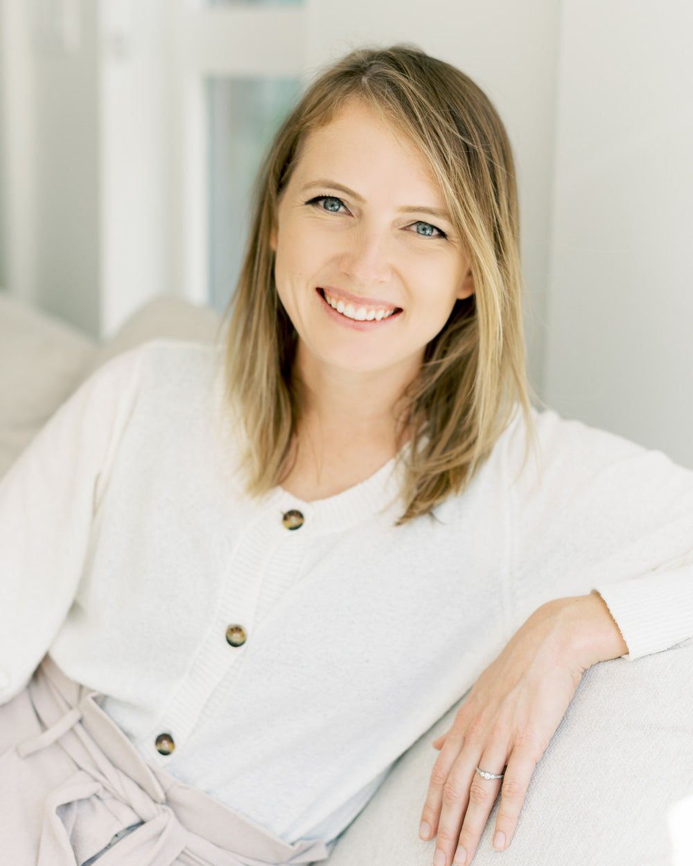 Entrepreneur sitting on a wicker chair in front of a ficus plant