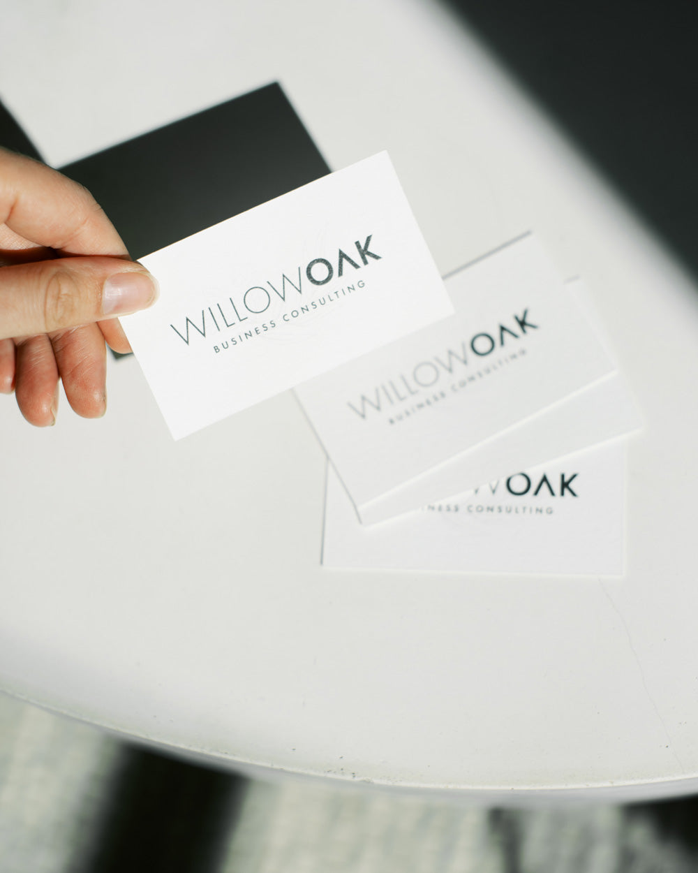 Willow Oak business cards placed on a bright white table