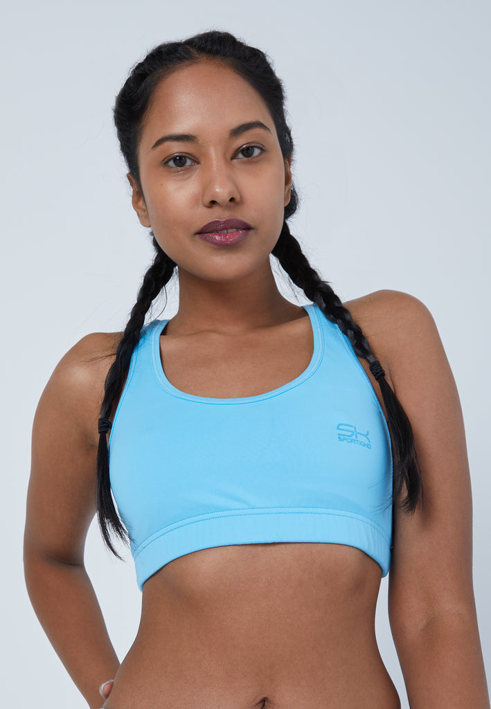Sports bra with crossed straps in cornflower blue for girls and women