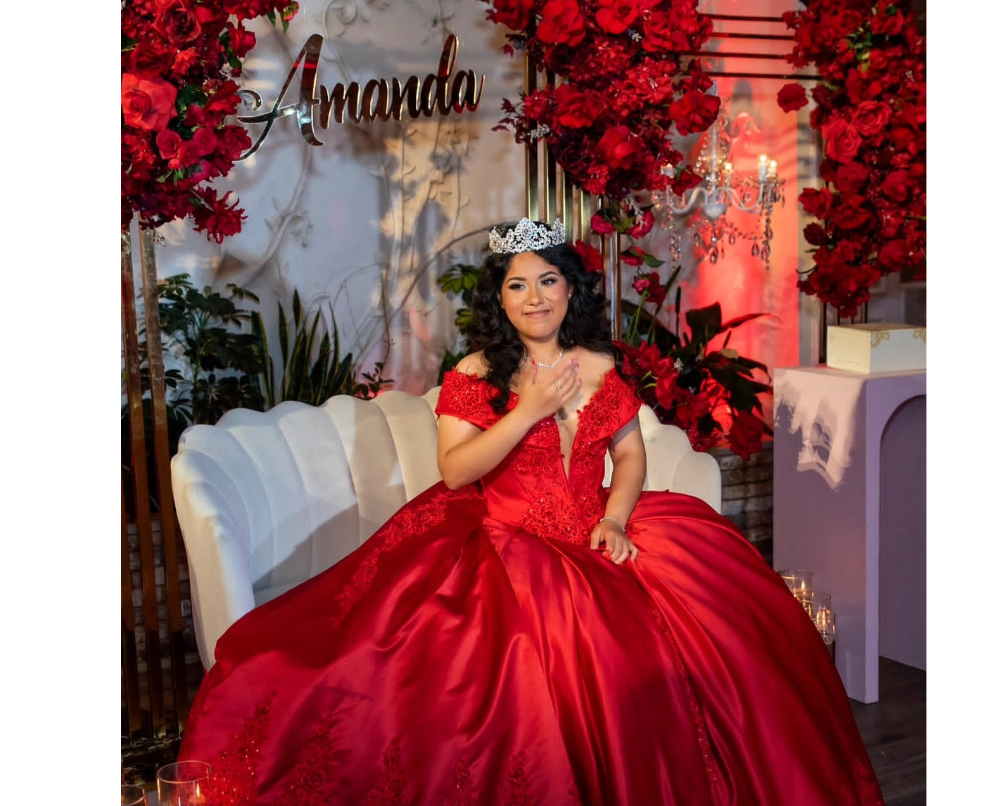 Amanda's sweet sixteen party! She's wearing a dramatic red ballgown and a sparkling Swarovski crystal tiara. 