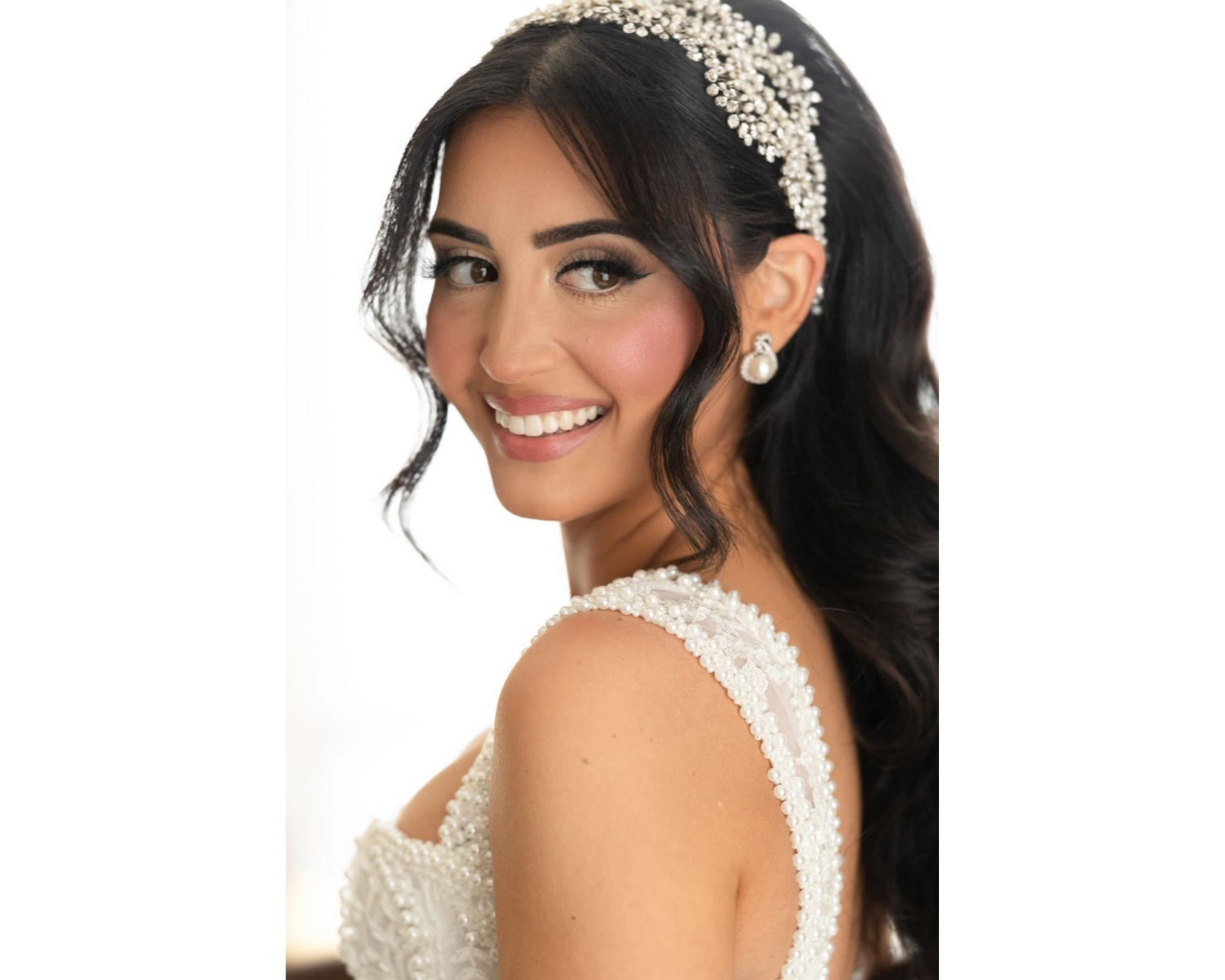 Our happy bride modeling her custom freshwater pearl and crystal hair vine headband