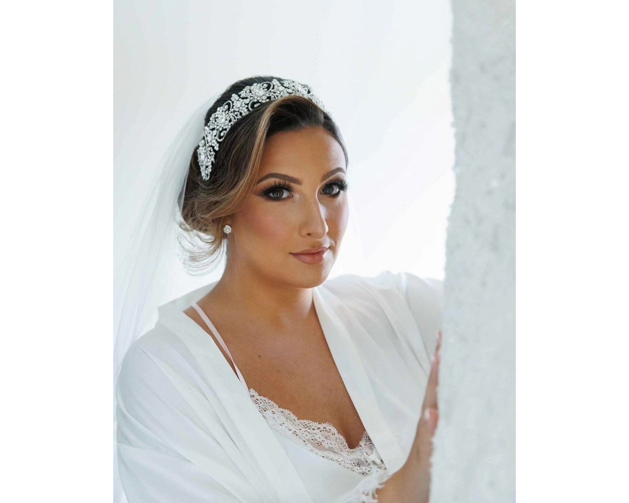 Beautiful bride Brittany getting ready for her day. She's wearing her Swarovski crystal headband from Bridal Styles Boutique.