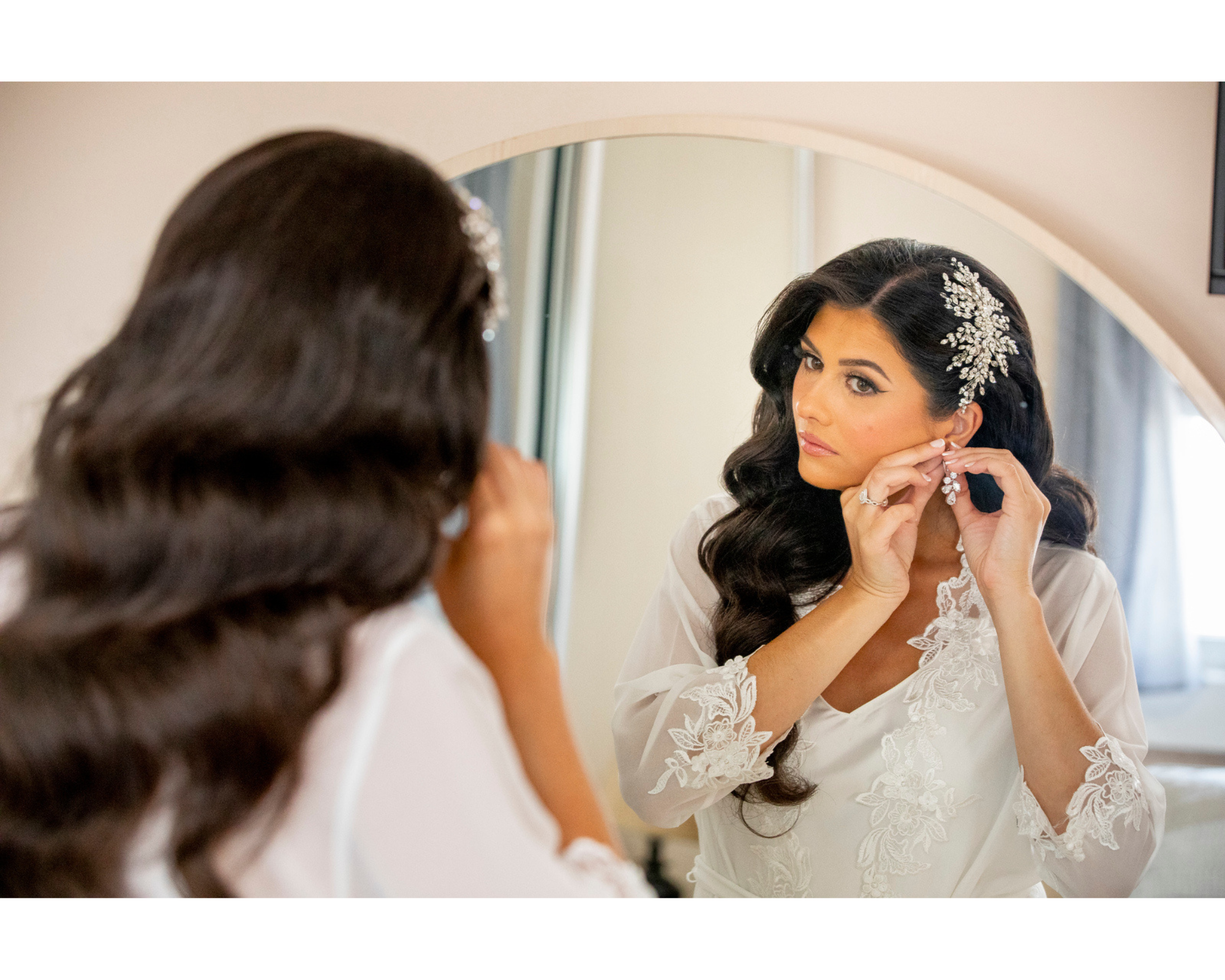 Noelle getting ready on her big day. She's wearing a Swarovski crystal bridal comb and jewelry, and a beautiful bridal robe.