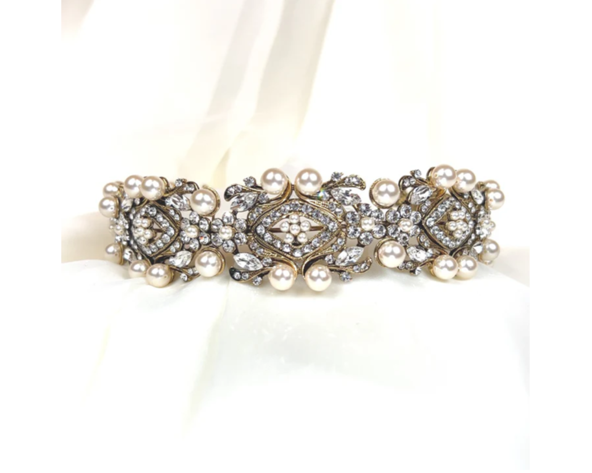 a crystal  and pearl gold headband with a luxe and vintage-inspired look