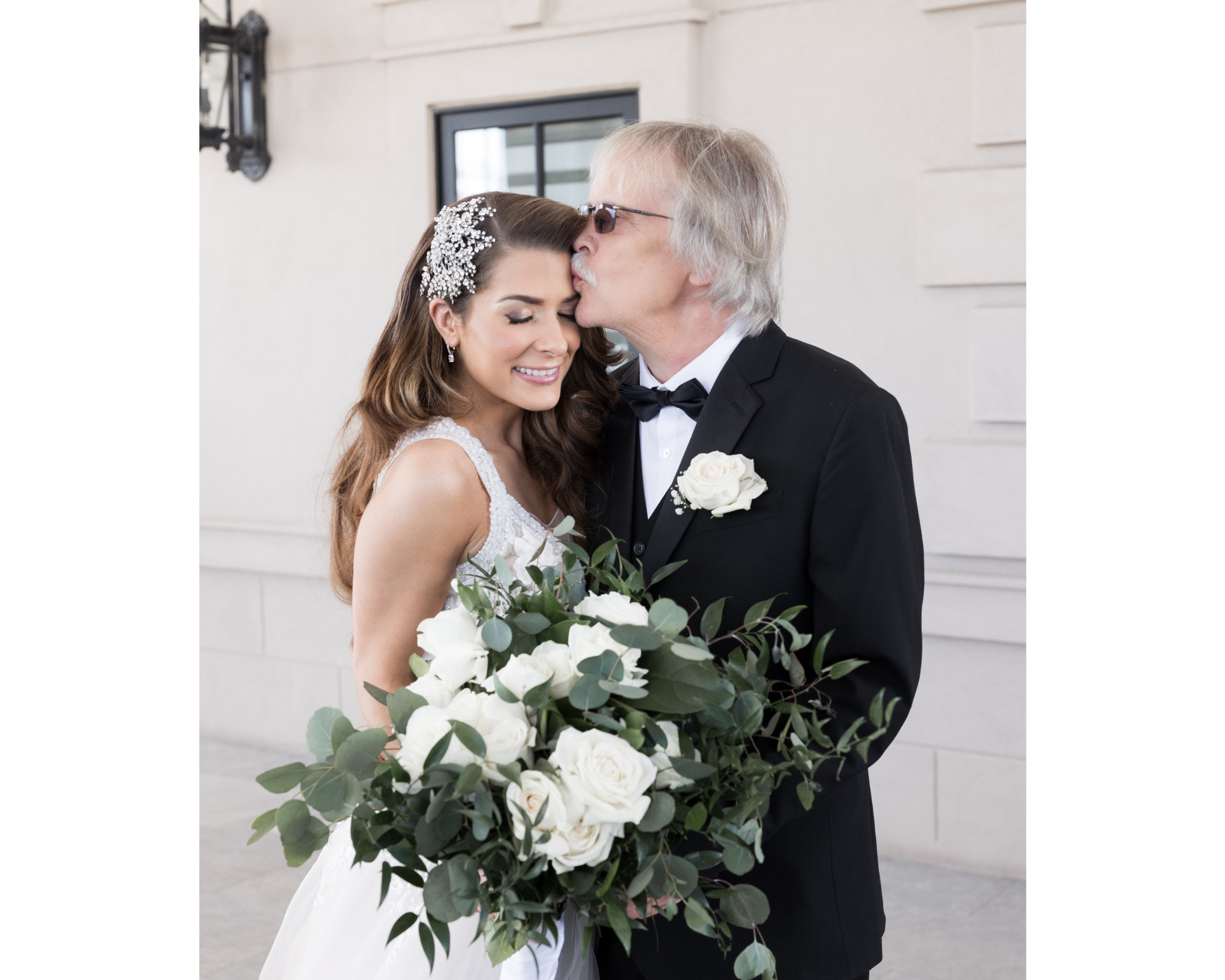 A touching moment between a stunning bride and her father. Our bride is wearing a dazzling Swarovski crystal bridal hair comb via Bridal Styles Boutique