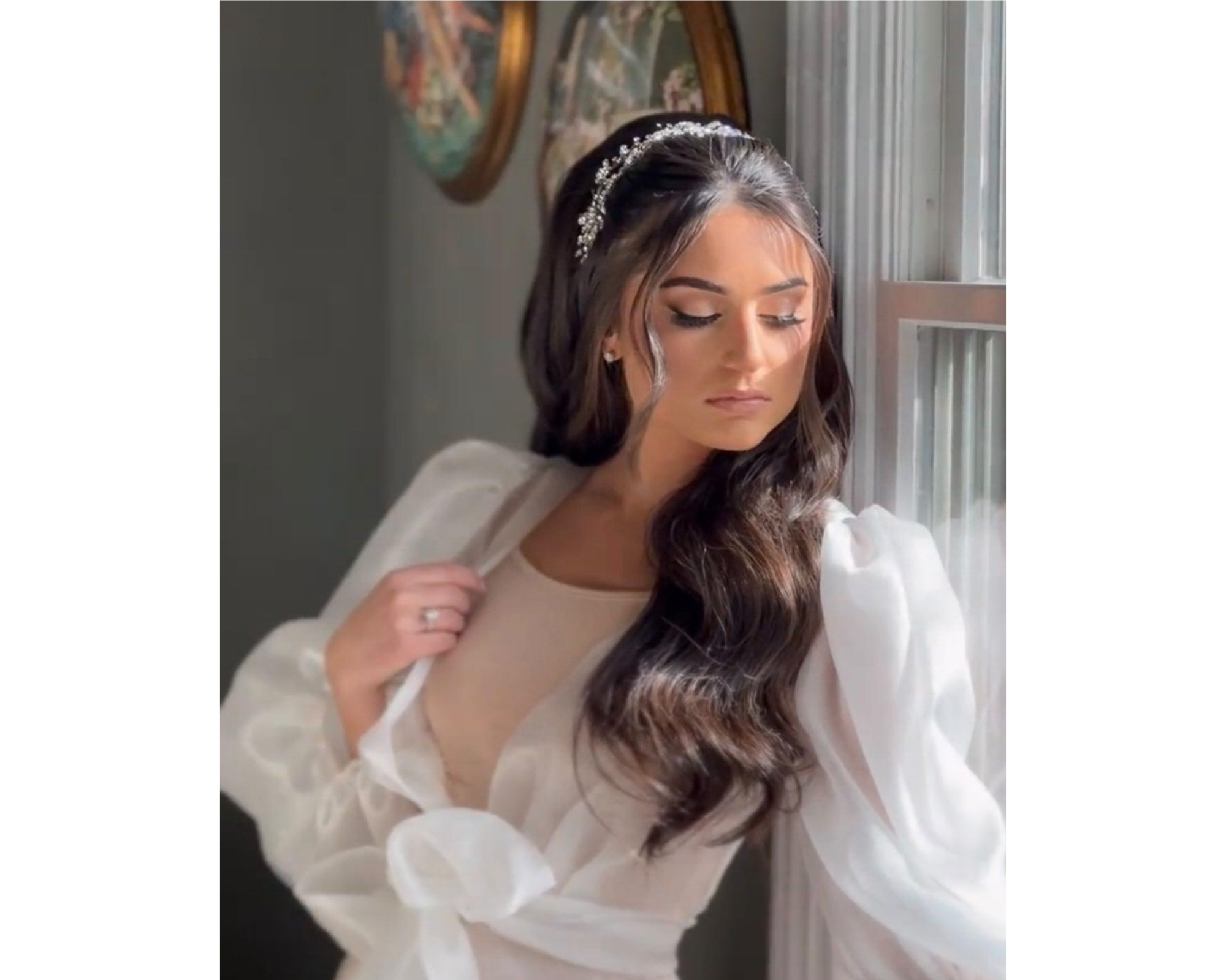 A beautiful bride wearing her hair down with a delicate crystal bridal hair vine
