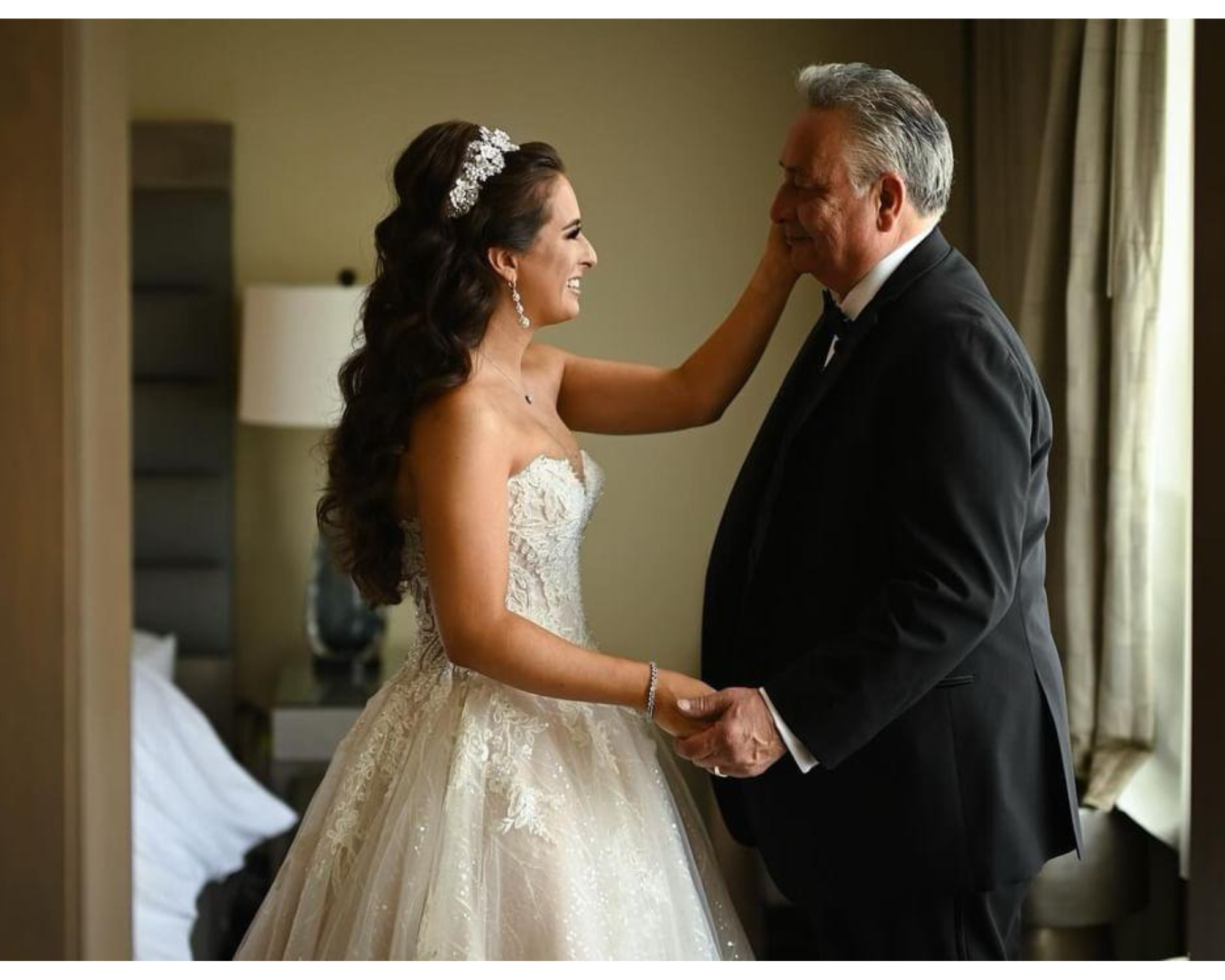 A beautiful bride’s first look with her dad. She is wearing an elegant wedding dress with  her hair down and custom crystal flower headband.