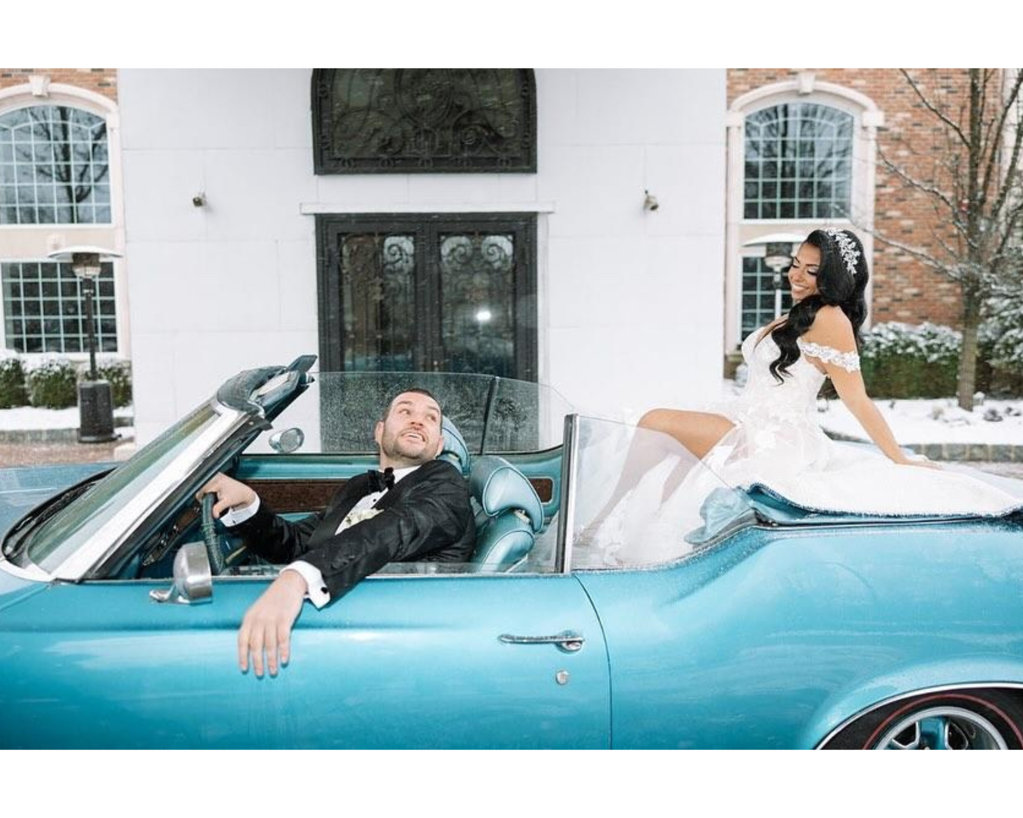 Cassandra rides in the back of a turquoise vintage convertible while her groom drives.