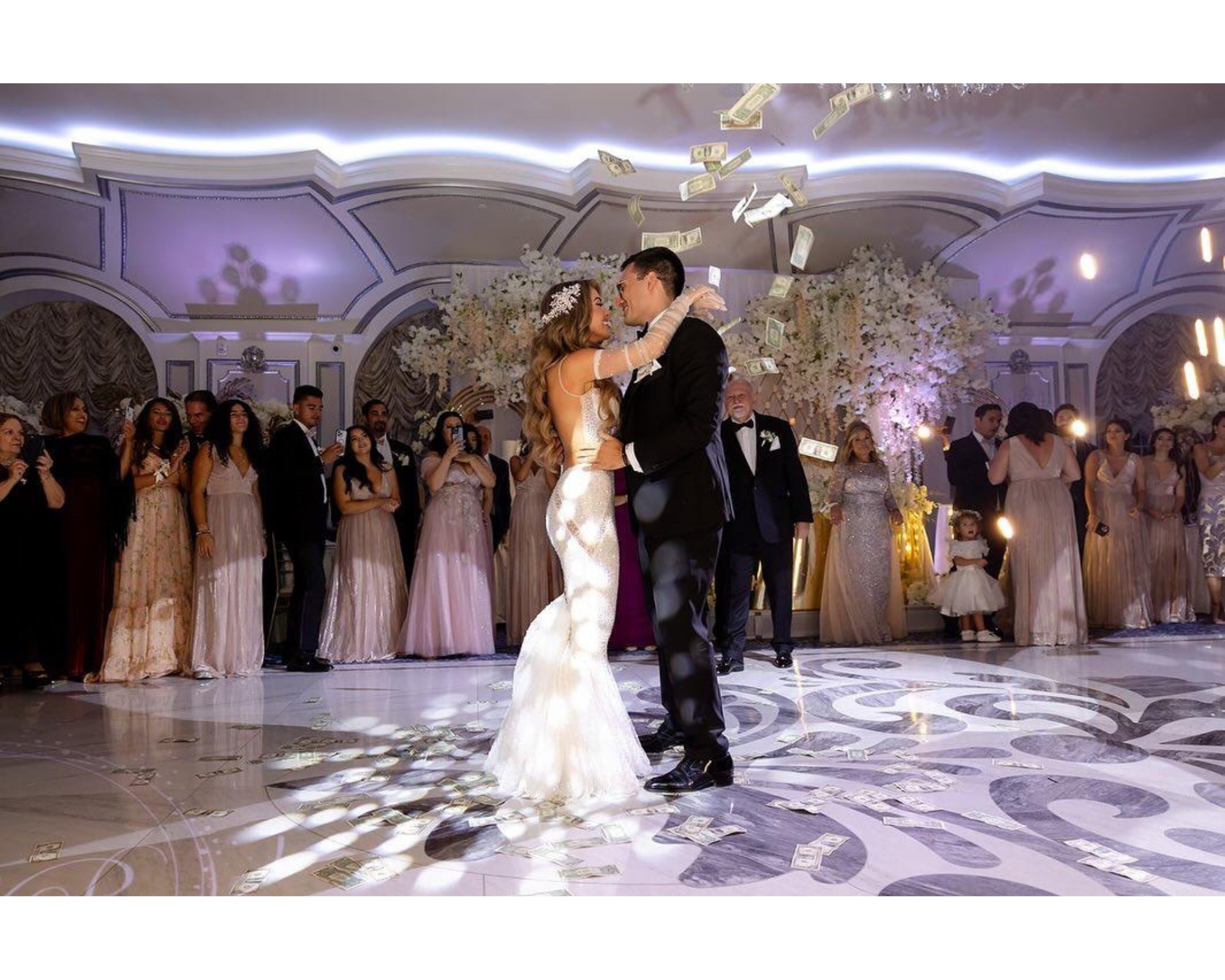Our beautiful bride Ioanna  dancing with her handsome groom on a purple and white dance floor.