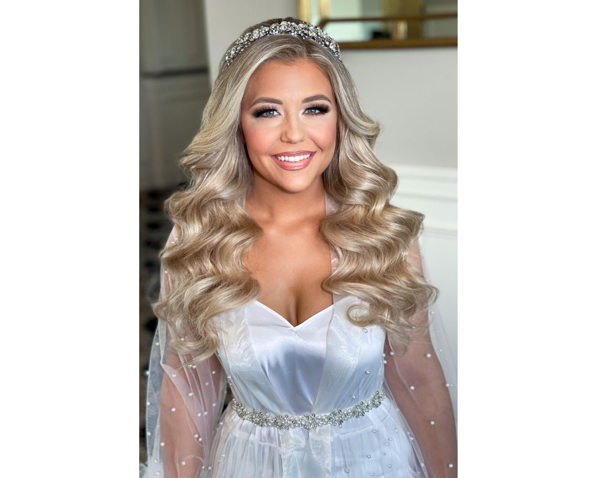 Beautiful bride Marissa on her wedding day! Her hair is in glam waves, and she’s wearing a Swarovski crystal headpiece.