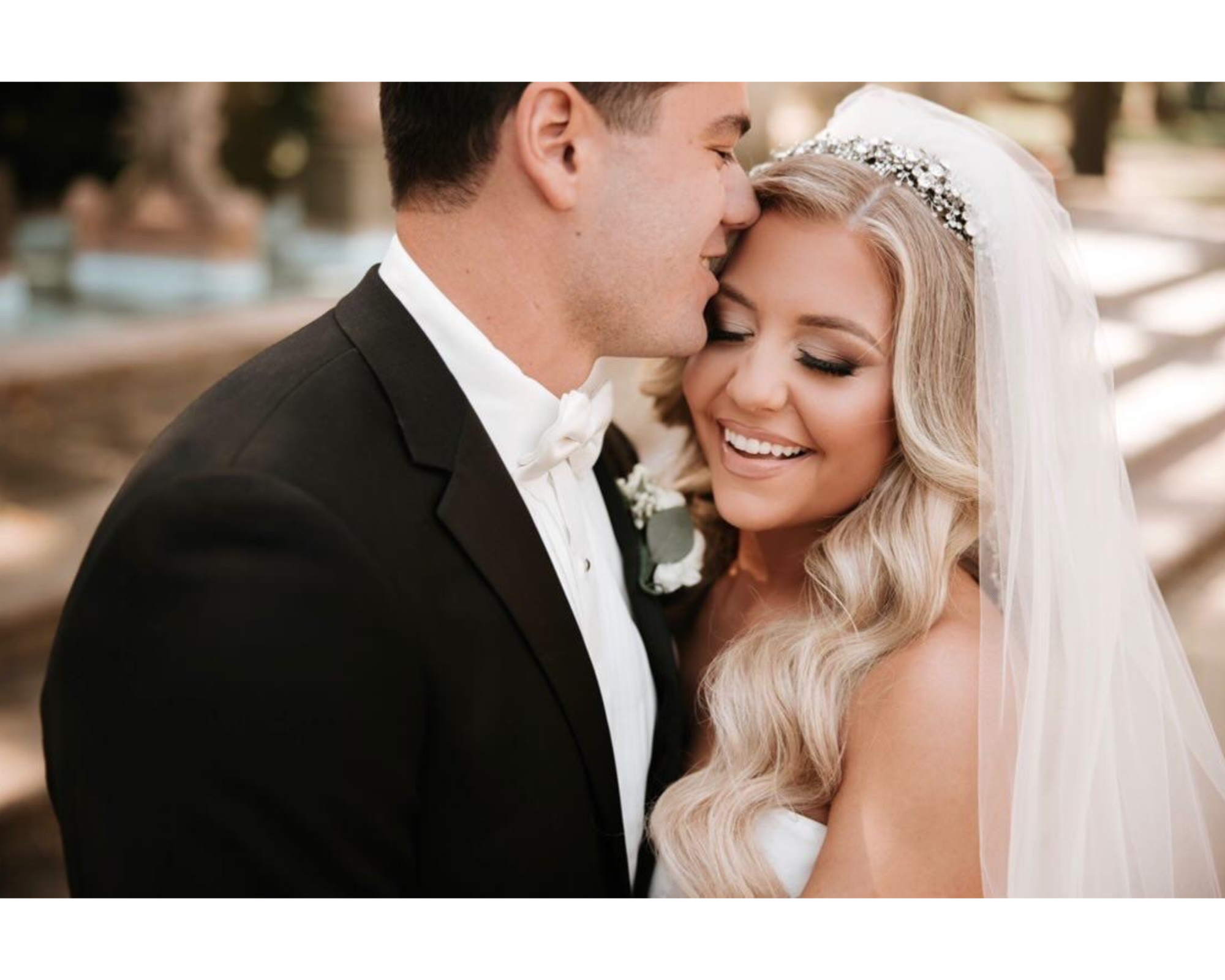 Beautiful bride Marissa with her groom!  Her hair is in glam waves, and she’s wearing a Swarovski crystal headpiece.