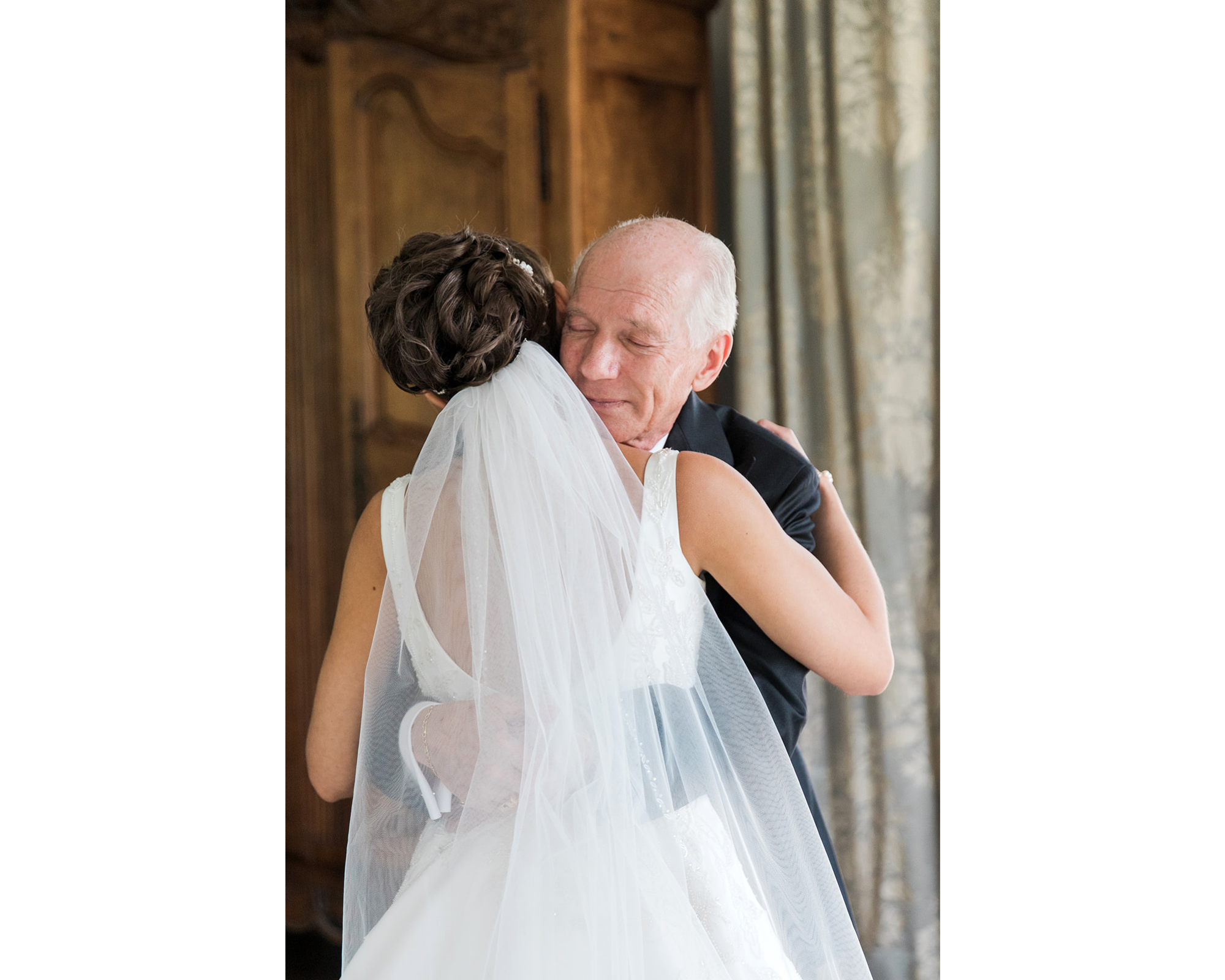 An emotional moment between a lovely bride and her father. Our bride is wearing a statement Swarovski crystal headpiece via Bridal Styles Boutique.]