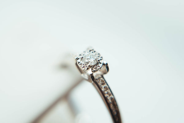 macro photography of a sterling silver ring with crystal accents