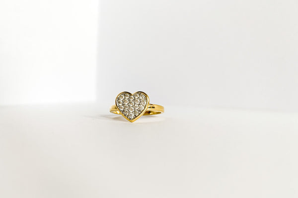 gold-plated cz fashion ring with a heart design on a white surface