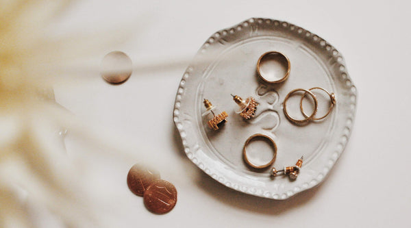 overhead shot of fashion rings on a diy ring plate