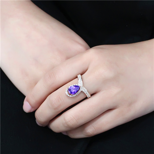 woman's hand wearing CeriJewelry’s Rose Gold Plated Stainless Steel Tanzanite CZ Fashion Ring