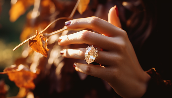 woman wearing a marquise-cut champagne-colored crystal fashion ring on her finger