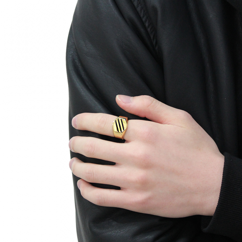 Man wearing a gold-plated stainless steel ring on his index finger