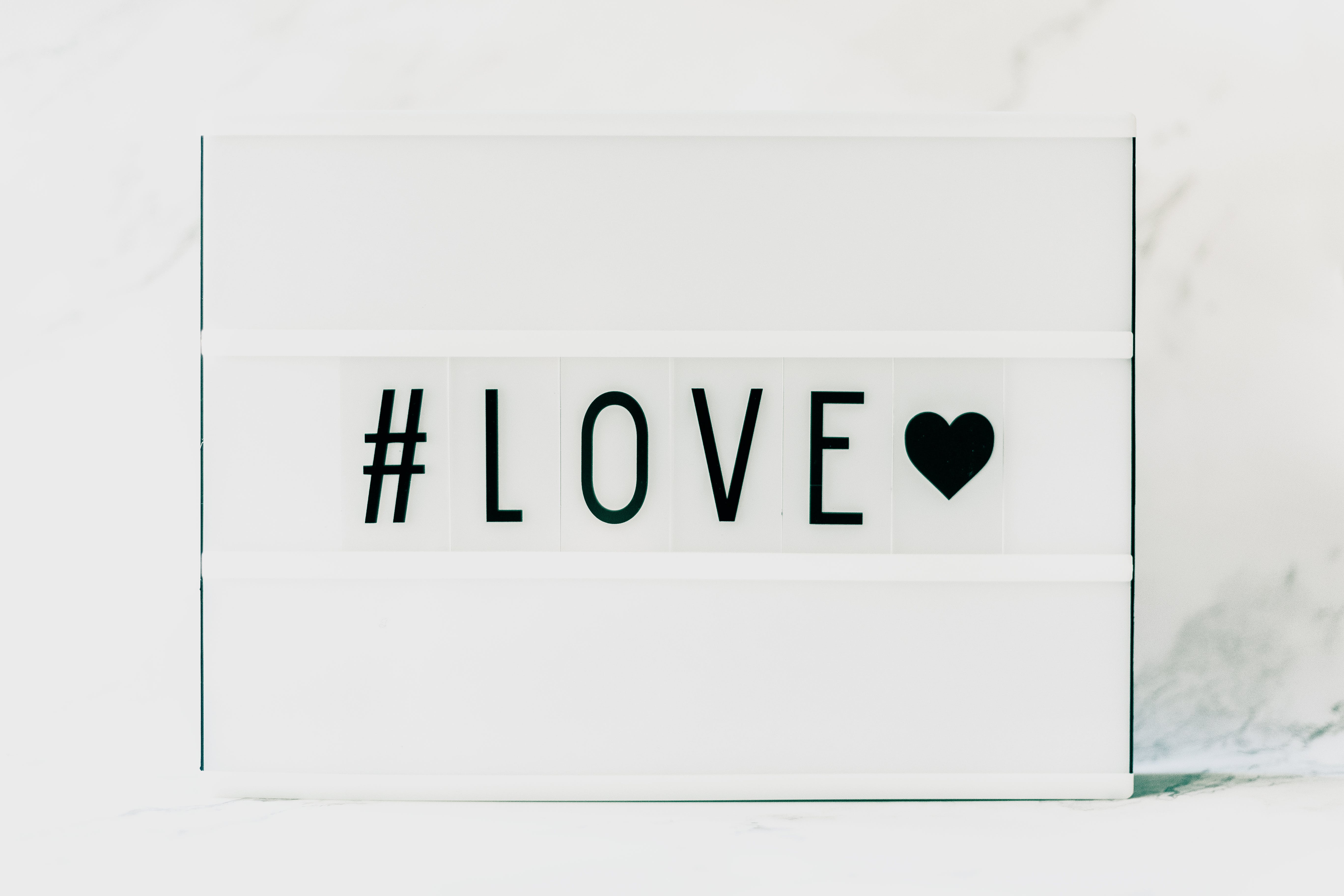 signage that says #LOVE with a heart