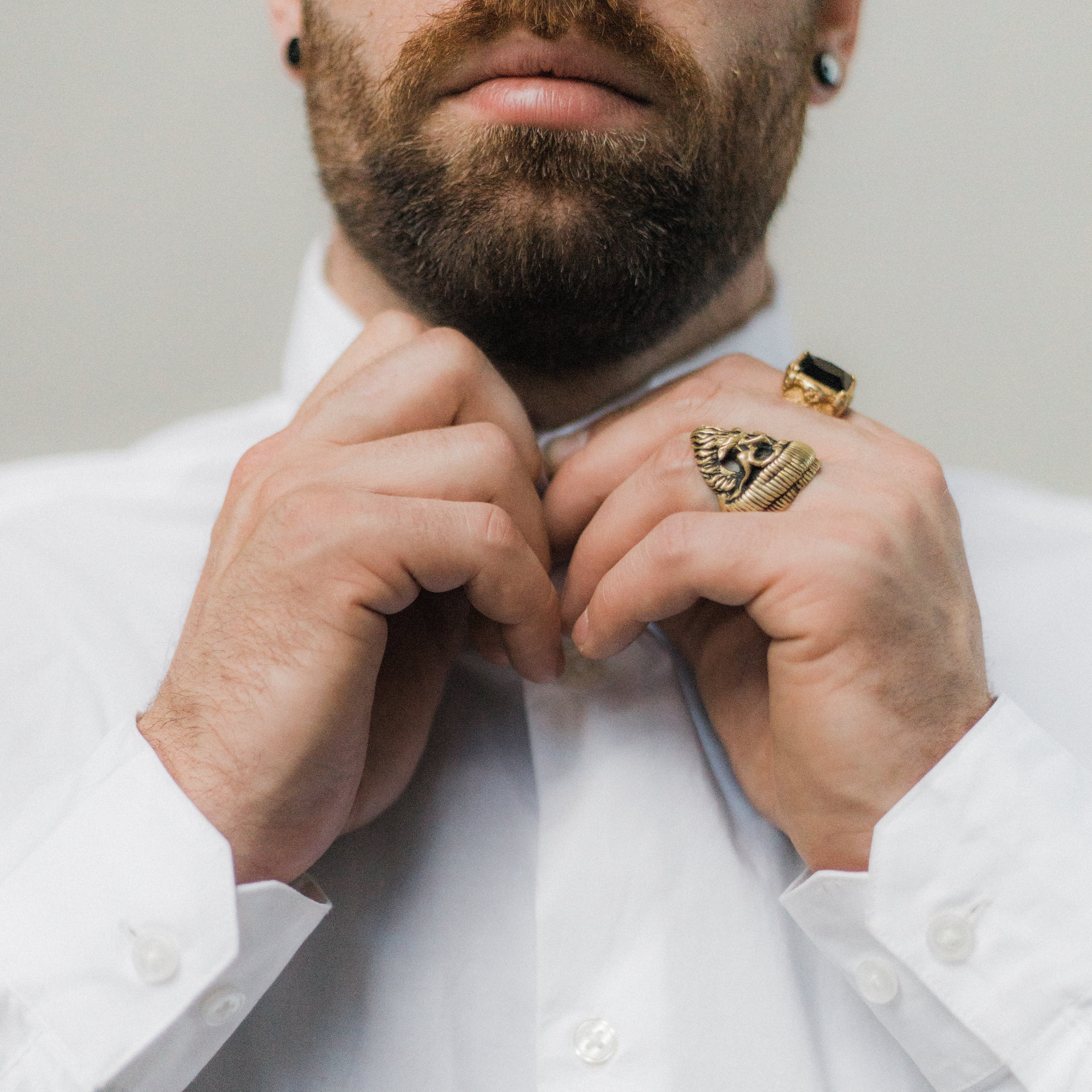 A men wearing fashion rings for men.