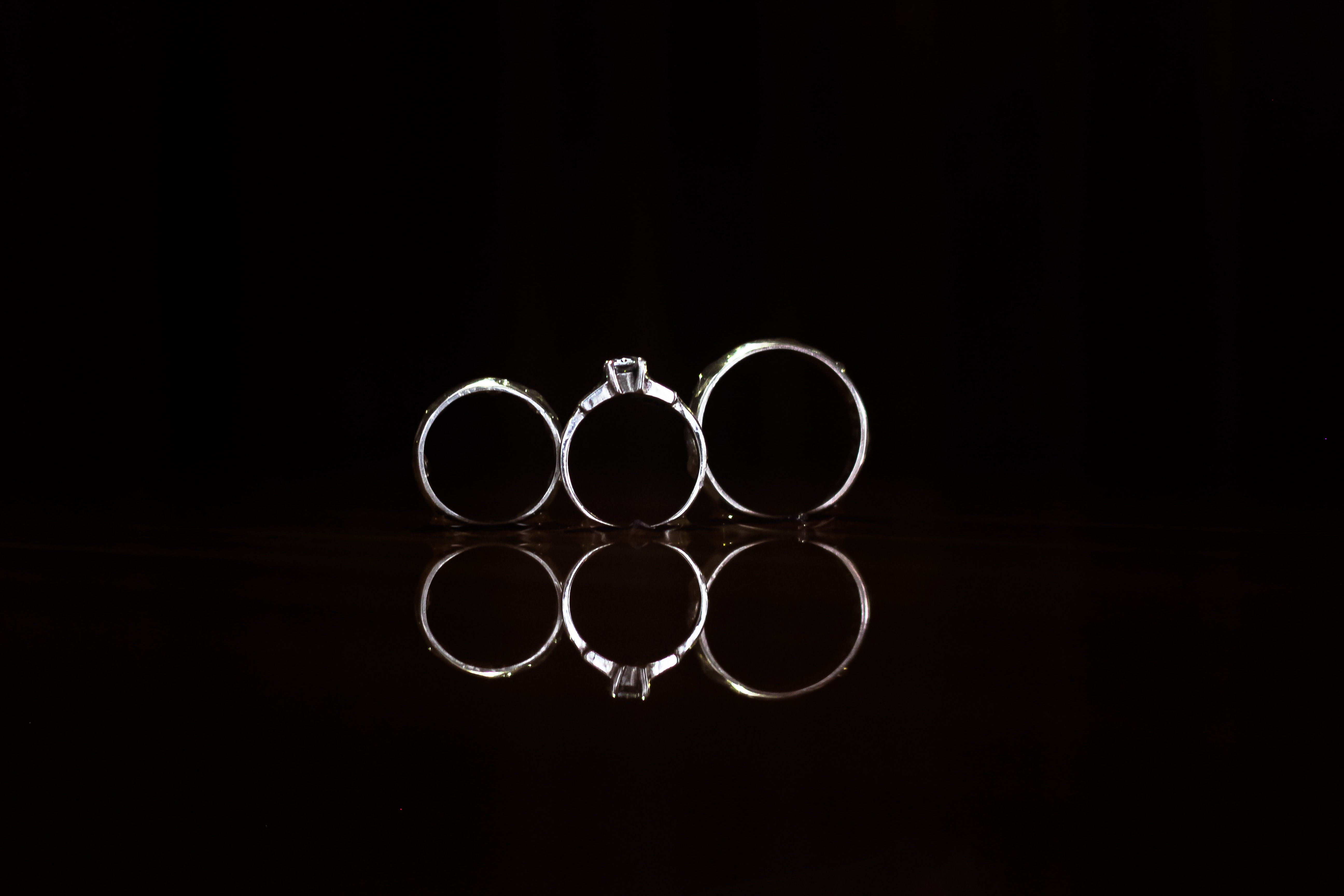 stainless steel wedding rings in dark background