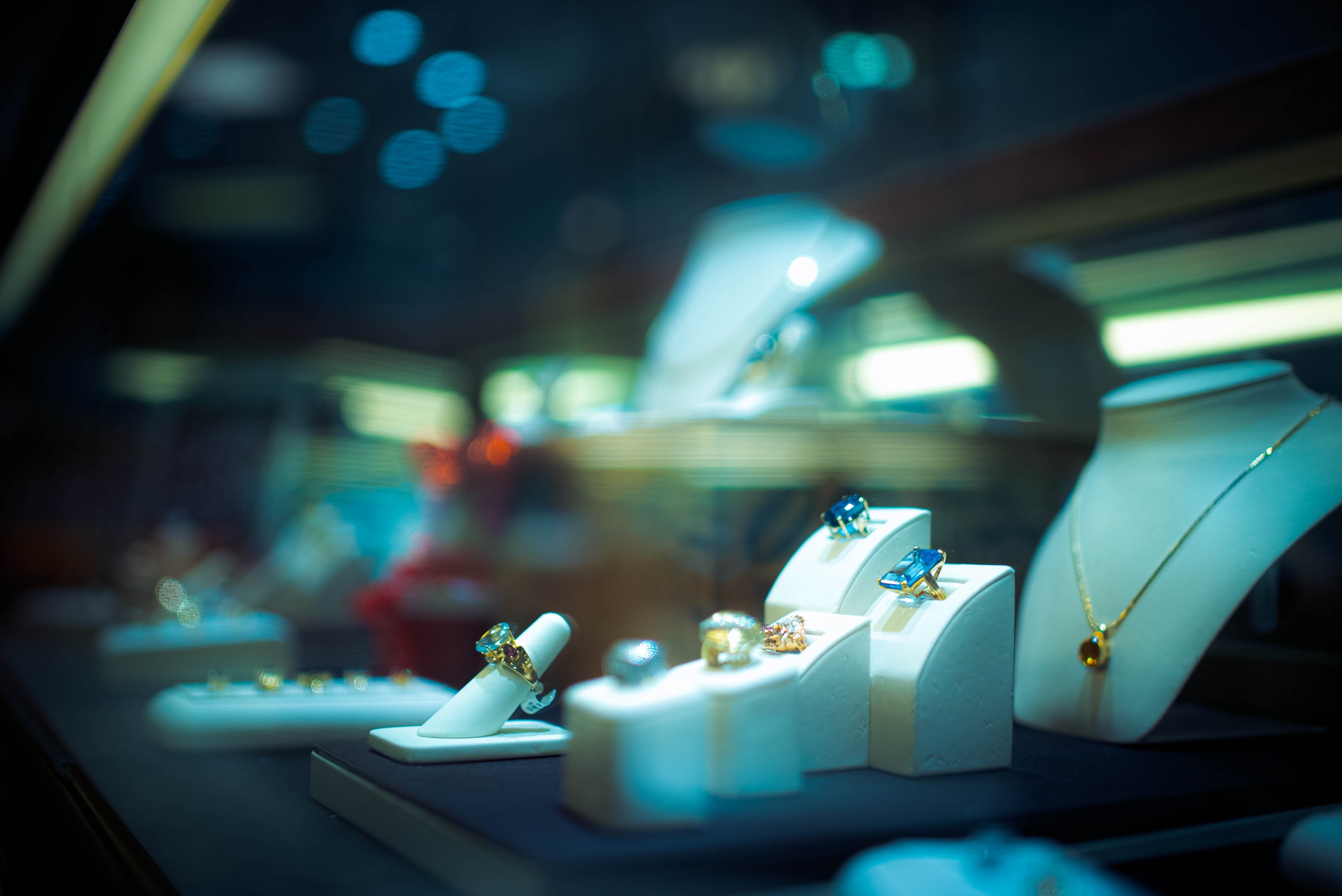 assorted fashion jewelry on display with blurred background