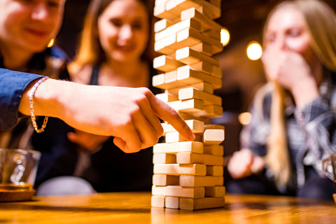 Playing Jenga strategy game for family game night