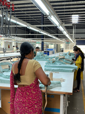 Workers bundling cut pieces of garments to prepare for sewing