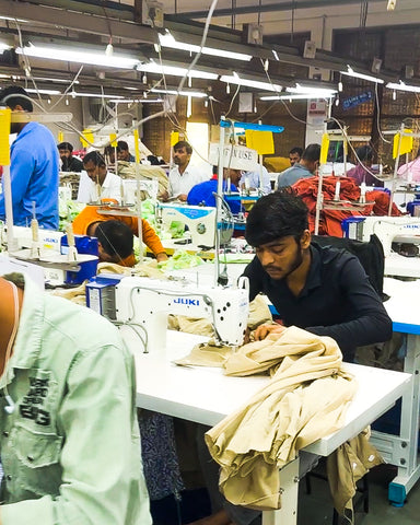 A man sewing a garment