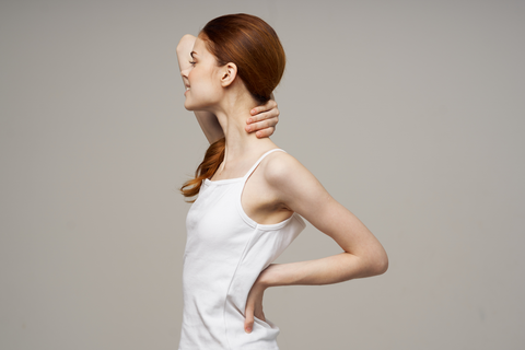 woman suffering with painful neck pain